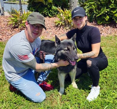 1674
CHESTER WITH NEW DAD JOE AND MOM LAYLA DOG 1674
